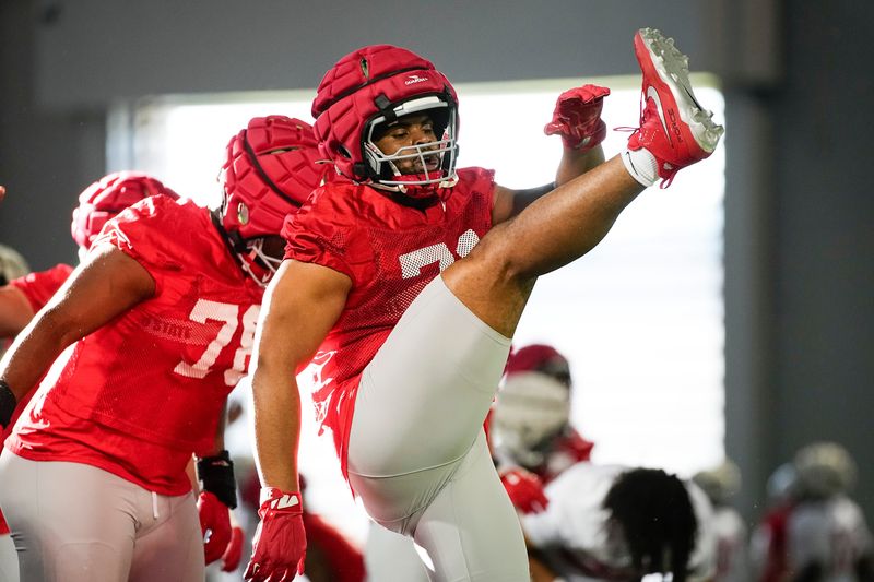 Ohio State Buckeyes offensive lineman Jayvon McFadden (71) stretches during spring football practice at the Woody Hayes Athletic Center in Columbus on March 17, 2025.