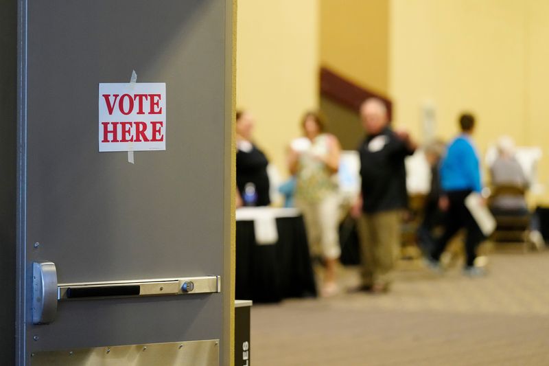 Early voters cast ballots at the Northern Kentucky Convention Center in Covington, Ky., on Thursday, Nov. 3, 2022.