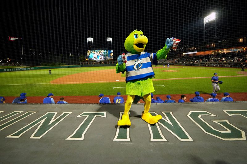 Sep 14, 2022; Columbus, OH, USA; Columbus Clippers mascot Krash hands out peanuts and Cracker Jacks as fans sing "Take Me Out to the Ballgame" in the seventh inning stretch during the Minor Leage Baseball game against the Omaha Storm Chasers at Huntington Park. Mandatory Credit: Adam Cairns-The Columbus Dispatch

Clippers 0914 Ac 24