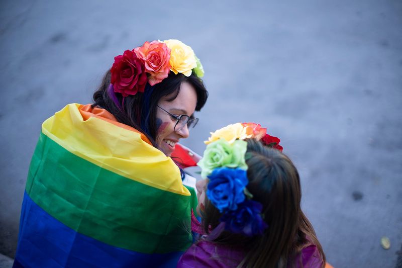Jun 18, 2022; Columbus, OH, United States; Kelsey Sheppard, and her daughter Ruby, 9, of North Ridgeville, near Cleveland, wait for the Columbus Pride Parade to start. Thousands turned out Saturday for Stonewall Columbus' Pride parade Downtown. It was the first in-person event since 2019 and a welcome sight for many.