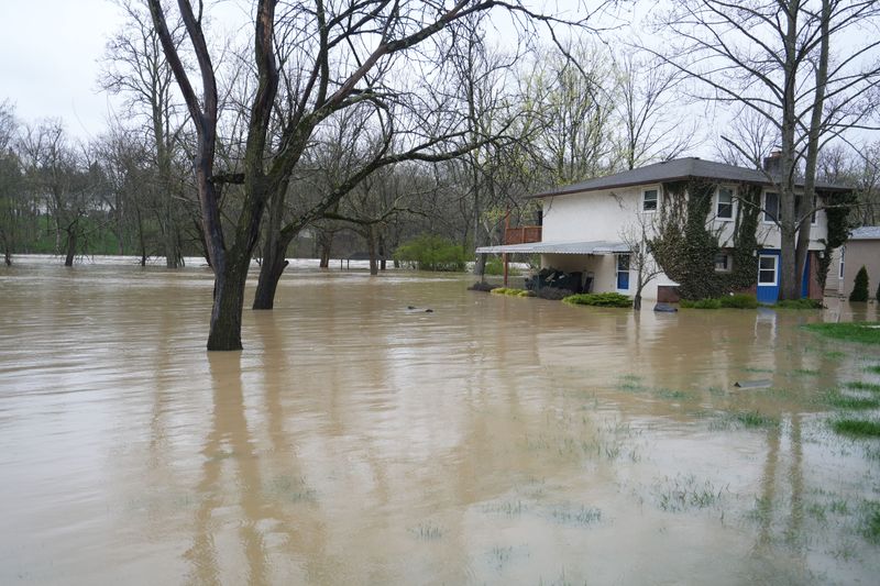 The Scioto River reachers a home along Riverside Dr. just south of the Columbus Zoo Sunday, April 6, 2025.