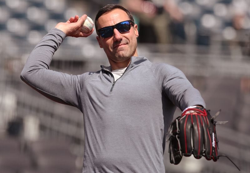 Apr 20, 2025; Pittsburgh, Pennsylvania, USA; Cleveland Guardians President of Baseball Operations Chris Antonetti tosses a baseball on the field before the game against the Pittsburgh Pirates at PNC Park. Mandatory Credit: Charles LeClaire-Imagn Images