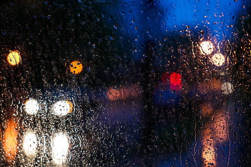 Street lights reflect off a rain soaked window on 4th Street on Tuesday, April 29, 2025 in Columbus, Ohio.