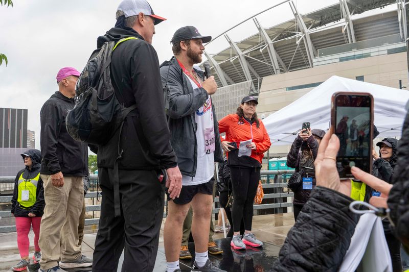 Cincinnati Bengals center Ted Karras addressed the crowd before the 2025 PigAbilities race. He and teammate Dalton Risner are running in the 2026 Queen City Running 5K to support The Cincy Hat charity.