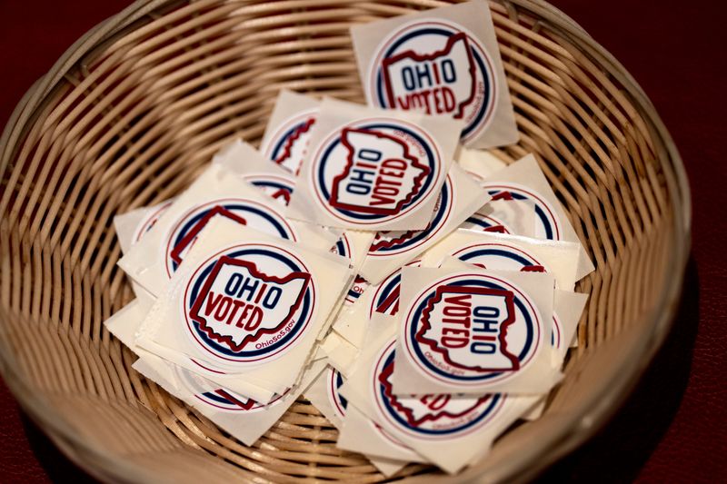 Voter stickers sit in a bowl at Knox Presbyterian Church, a polling location, in Hyde Park for the 2025 Primary Election on Tuesday, May 6, 2025.