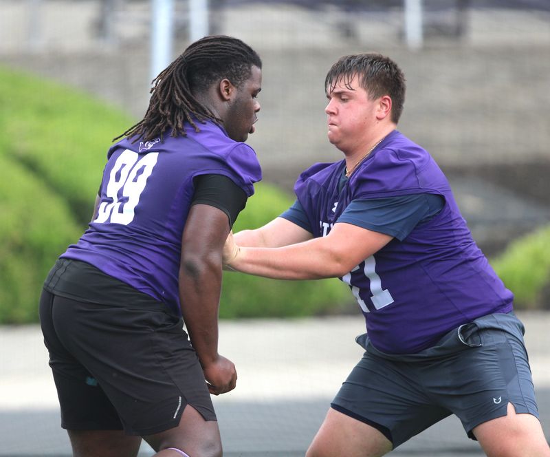 Elder's Tyrell Scott, left, is one of the top offensive linemen in Cincinnati ahead of the 2025 football season.