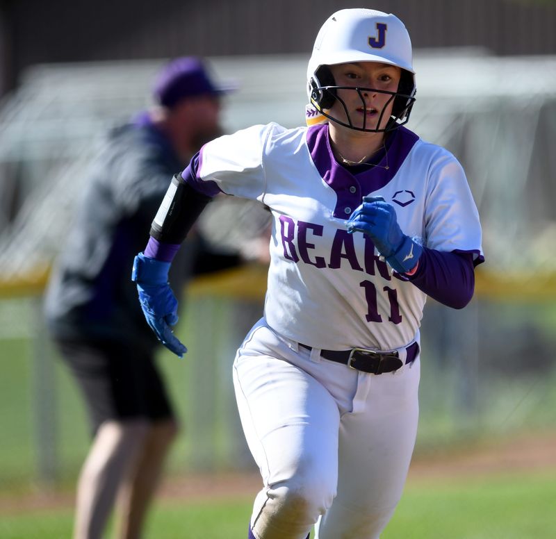 Jackson's Maddie Moden scores a first-inning run against Ellet, Friday, May 9, 2025