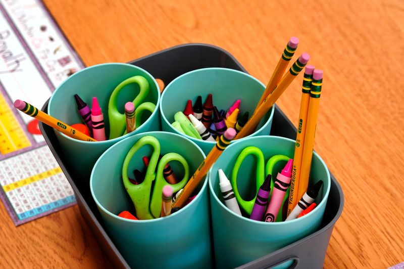 Supplies sit at the ready for first graders in Dolores Smith’s classroom on the first day of school at Ethel M. Taylor Academy, Thursday, August 17, 2023. The pre-k through 6th grade in Millville, has an enrollment of 247 students. The Cincinnati Public School is considered a neighborhood school and many of the students walk to school.