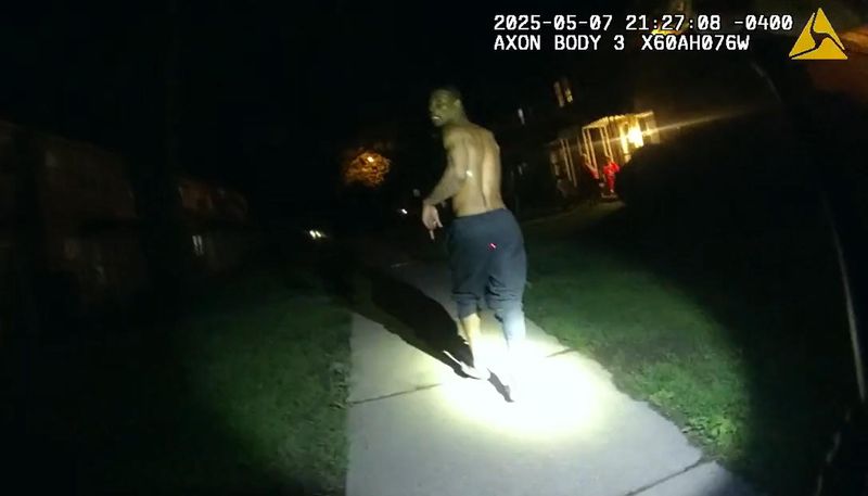 Screenshot of worn-body camera footage showing the moments leading up Dontay Auston's arrest, in which two officers repeatedly punch him in the head. Auston had ran from police.