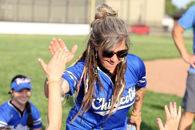 Chillicothe coach Andrea Morgan high-fives her players after they defeated Unioto in the district tournament on May 15, 2025.