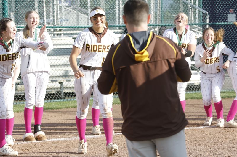 West Jefferson's Jenna Mannon walks up to receive her Division VI district championship medal from athletic director Mitch Daulton last season after pitching a shutout.
