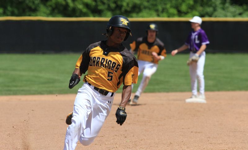 Watkins Memorial's Cam Burt approaches third during the Warriors' 4-1 victory against Logan in a Division II district semifinal at New Albany on May 24, 2025.