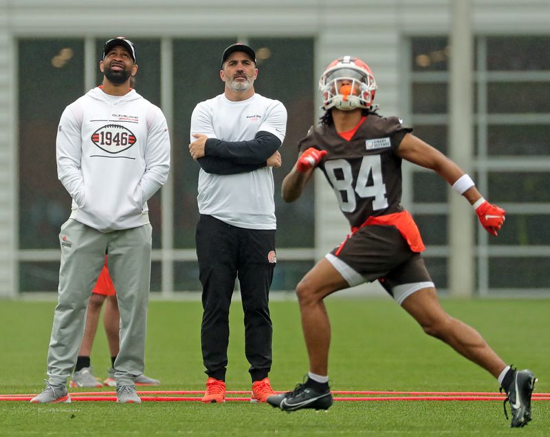 Cleveland Browns general manager Andrew Berry, left, and coach Kevin Stefanski watch as wide receiver Gage Larvadain practices with the special teams during a practice at the team's training facility May 28, 2025, in Berea, Ohio.