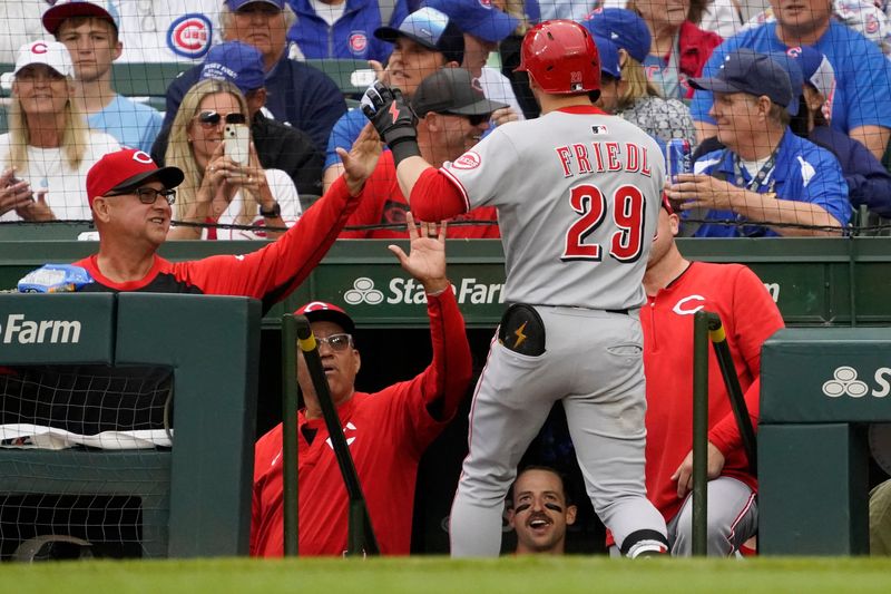 Reds outfielder TJ Friedl is congratulated by manager Terry Francona