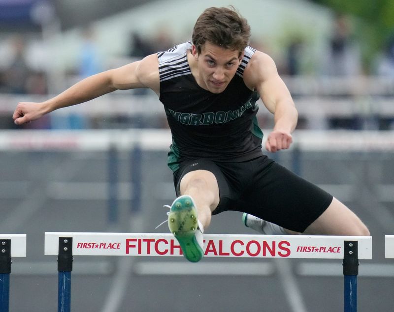 Nordonia’s Joseph Filisky clears the last hurdle in the 300-meter hurdles at the Division I regional track meet May 30, 2025, at Austintown Fitch High School.