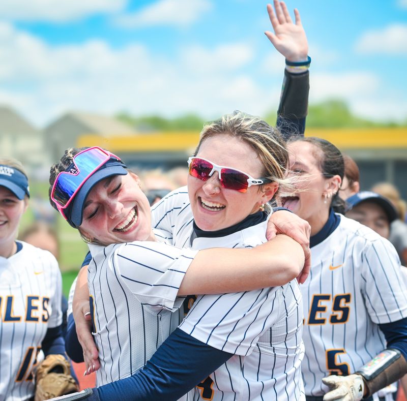 Lancaster’s Kileigh Rohr (left) and Ashlin Mowery celebrate following a 5-2 win over Gahanna Lincoln in a Division I regional final May 31 at Olentangy.