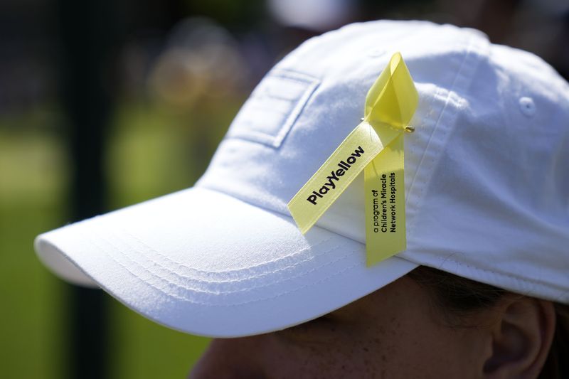 Jun 9, 2024; Dublin, Ohio, USA; A detailed view of the Play Yellow ribbon during the final round of the Memorial Tournament at Muirfield Village Golf Club.