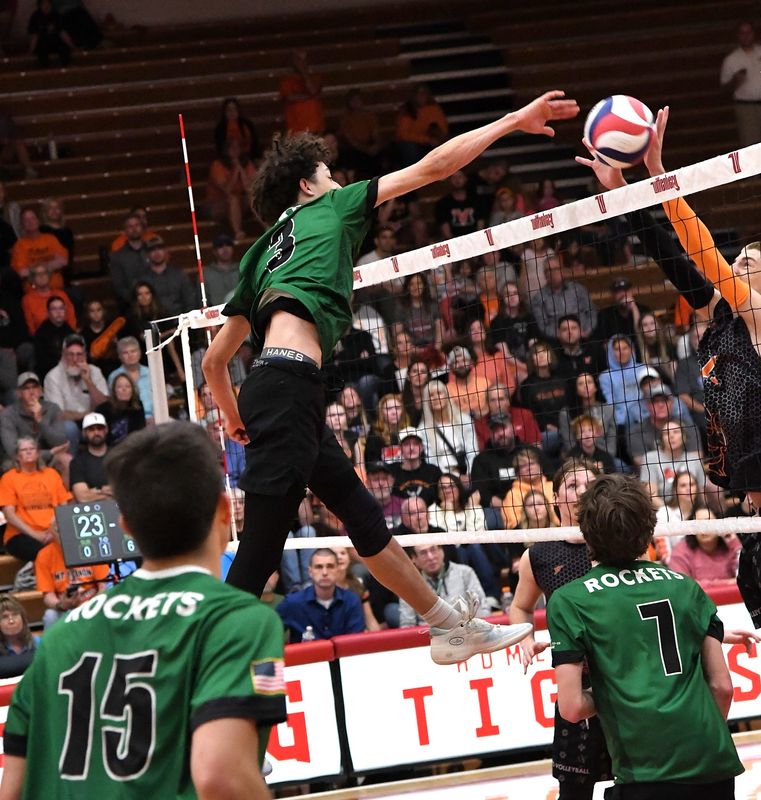 Aydan Williams (3) scores at the net for McNicholas to put the Rockets within two points of sweeping Mount Vernon for the title at the OHSAA boys Division II state volleyball championship, Wittenberg University, May 31, 2025.