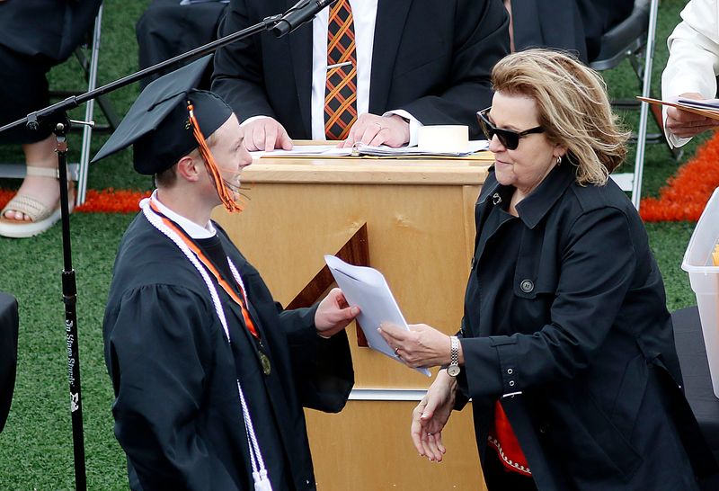 Owen Lemon receives his diploma at Ashland High School’s Class of 2025 graduation ceremony at Community Stadium Saturday, May 31, 2025.
