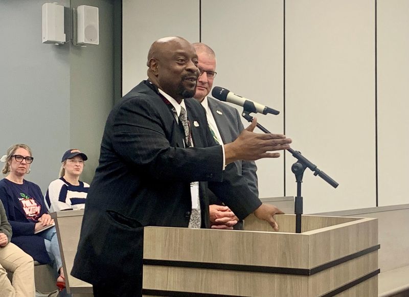 Canton City Schools Superintendent Jeff Talbert, left, explains to Canton City Council how the proposed state budget would reduce resources for students. Plain Local Superintendent Brent May, right, said the proposed cuts also would negatively impact Plain students.