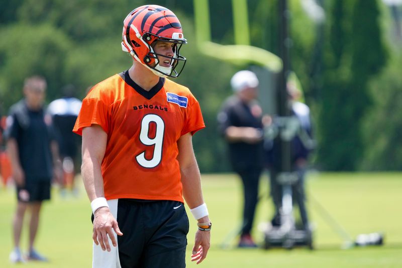 Cincinnati Bengals quarterback Joe Burrow (9) prepares for a play during a session of organized team activities on the Bengals practice field at Paycor Stadium in downtown Cincinnati on Tuesday, June 3, 2025.