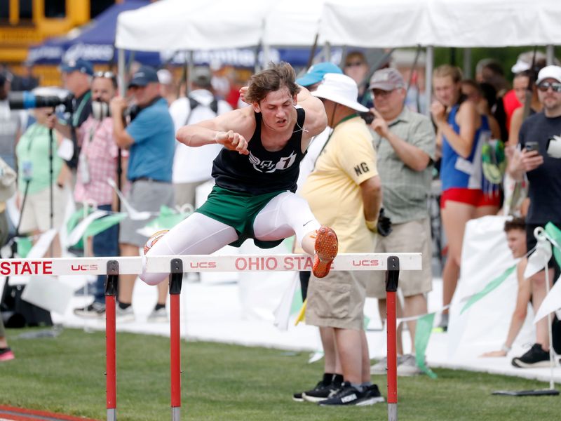Oak Harbor's Wyatt Augsburger runs the 110 high hurdles during the first day of the annual state track and field meet on Friday, June 6, 2025, at Ohio State's Jesse Owens Memorial Stadium,