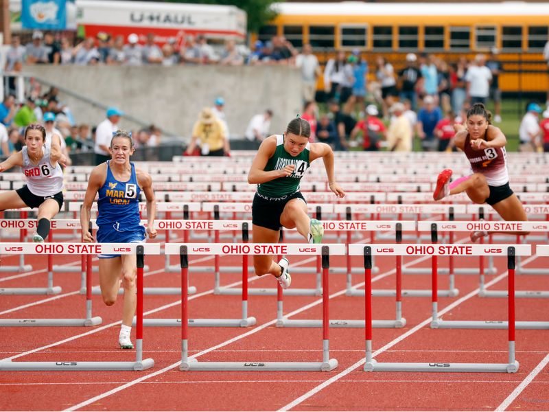 Northridge's Isabel Evans runs the 100 hurdles during the first day of the annual state track and field meet on Friday, June 6, 2025, at Ohio State's Jesse Owens Memorial Stadium.