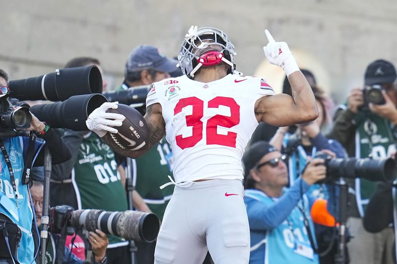 Ohio State Buckeyes running back TreVeyon Henderson (32) celebrates a touchdown during the first half of the College Football Playoff quarterfinal against the Oregon Ducks at the Rose Bowl in Pasadena, Calif. on Jan. 1, 2025.