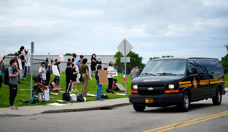 Protesters shouted, "Piggy, piggy” when sheriff's deputies drove past them during their demonstration outside the Butler County Jail on June 9. The morning protest was a response to the arrest of a member of their group on June 8.