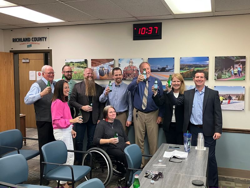 Richland County commissioners and representatives from Richland Area Chamber & Economic Development share a toast Tuesday morning after commissioners voted to create a port authority.