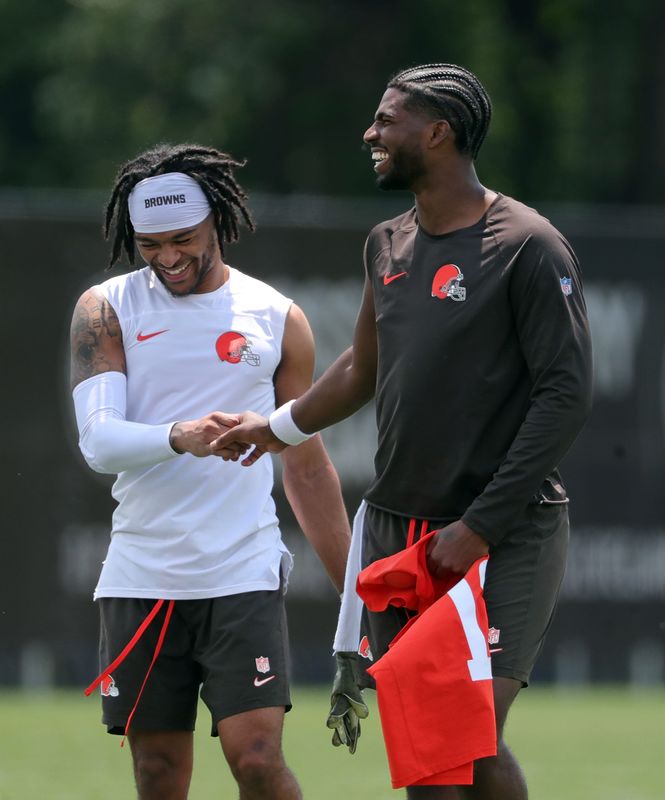 Shedeur Sanders (right) chats with Gage Larvadain after practice, June 10, 2025.