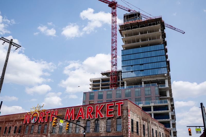 Construction continues on the North Market expansion and adjacent Merchant Building. The private project to expand the North Market and build the adjacent 32-story Merchant Building tower received $31 million in city investment after a narrow Columbus City Council vote. At the time, Council President Pro Tempore Rob Dorans voted against investing city dollars in the project in part due to concerns about labor protections. Now, Dorans is sponsoring city legislation that would require private projects with large city investments to pay prevailing wages for construction workers.