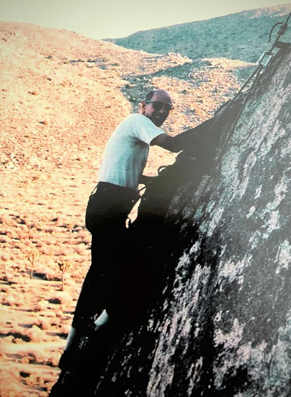 Robert Alt’s father, “Dr. Bob,” is shown climbing a steep rock face during one of his frequent outdoor adventures.