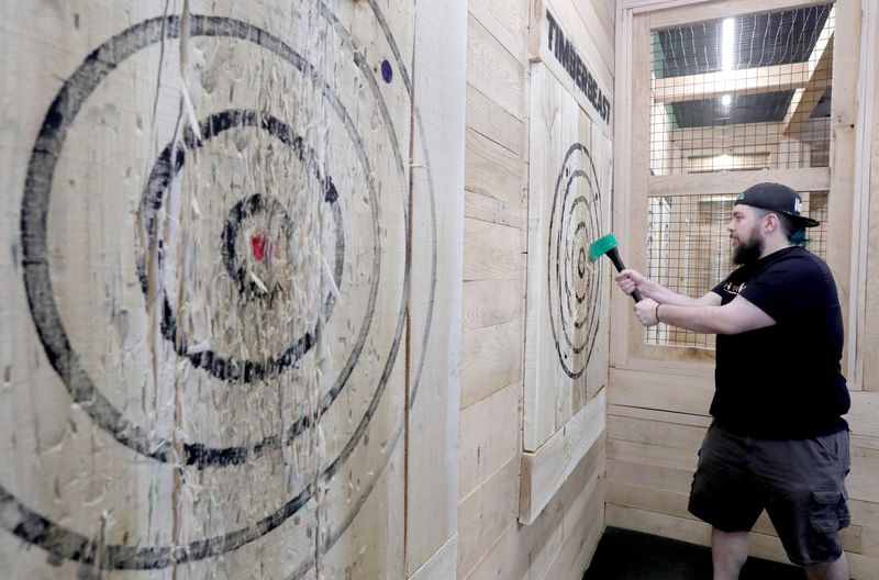 Logan Anderson retrieves an ax at TimberBeast in Barberton.