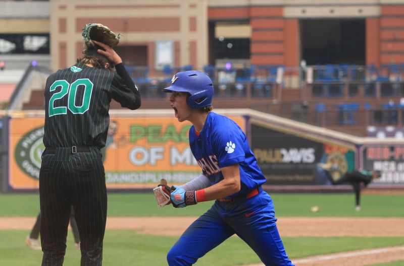Licking Valley's Brandt Lichtenauer celebrates scoring the winning run in the Panthers' 2-1 nine-inning victory against Badin in a Division III state semifinal at Canal Park on June 13, 2025.