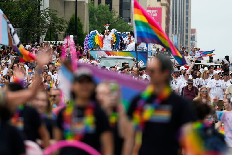 Marchers walk on High Street during the Stonewall Columbus Pride March in the Short North on Saturday, June 14, 2025 in Columbus, Ohio.