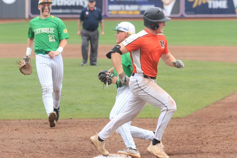 Minster's Reese Beair beats the flip of Newark Catholic's Owen Przymierski to Mikey Hess during the Green Wave's 8-0 loss in the Division VII state final at Canal Park on June 14, 2025.