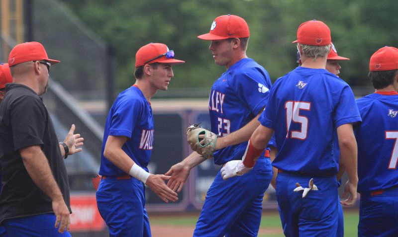 Licking Valley's bench congratulates Evan Roberts on ending an inning during the Panthers' 1-0 victory against University School to win the Division III state title at Canal Park on June 14, 2025.