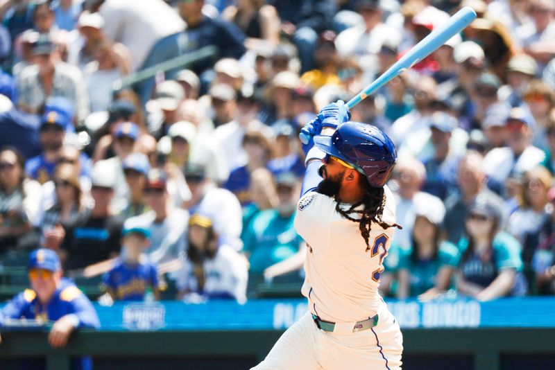 Jun 15, 2025; Seattle, Washington, USA; Seattle Mariners shortstop J.P. Crawford (3) hits a grand-slam home run Cleveland Guardians during the second inning at T-Mobile Park. Mandatory Credit: Joe Nicholson-Imagn Images