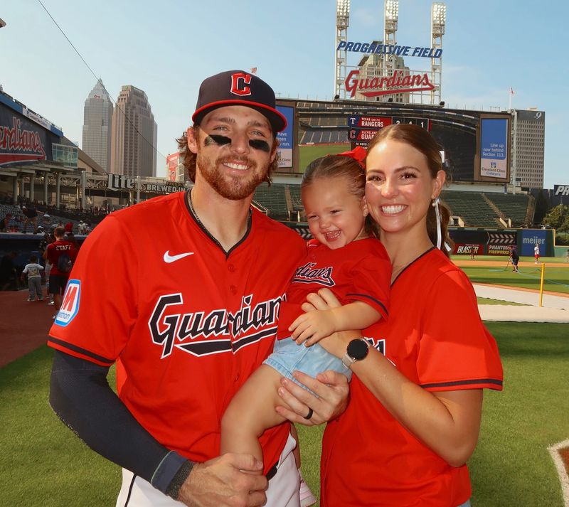 Cleveland Guardians utility player Daniel Schneemann, BYU assistant softball coach Allie Hancock-Schneemann and their daughter, Kendall, at Progressive Field.