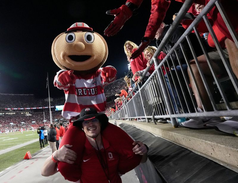 Sept. 7, 2024; Columbus, Ohio, USA;
Brutus Buckeye greets fans during the second half of an NCAA Division I football game against the Western Michigan Broncos on Saturday at Ohio Stadium.