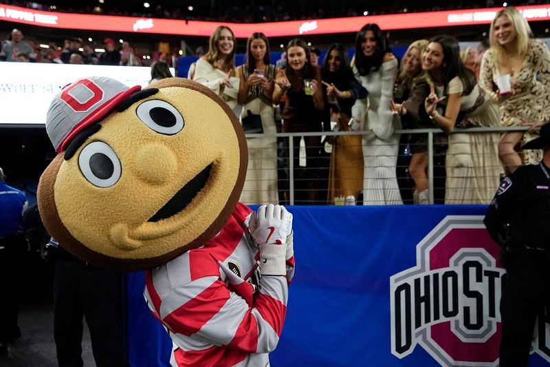 Ohio State Buckeyes mascot Brutus interacts with Texas Longhorns fans during the first half of the Cotton Bowl Classic College Football Playoff semifinal game at AT&T Stadium in Arlington, Texas on Jan. 10, 2025.