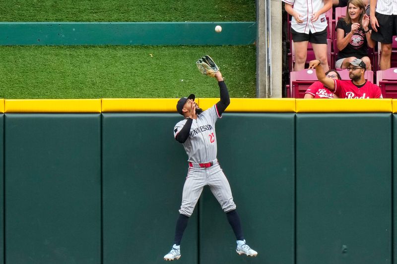 Twins center fielder Byron Buxton kept the Reds from taking an early lead when he went above the wall to rob Will Benson of a solo home run in the second inning. Buxton came to the plate in the next half inning and homered for a 1-0 Twins lead.