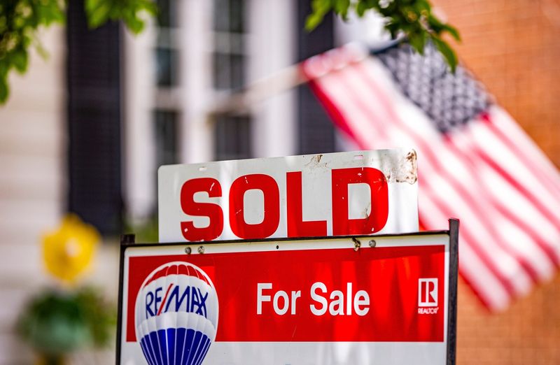 A SOLD sign is attached to a For Sale sign outside a home on Friday, May 21, 2021.