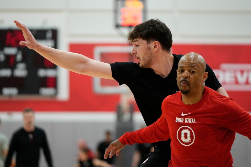 Ohio State Buckeyes center Ivan Njegovan defends behind assistant coach Jamall Walker during offseason practice at the Schottenstein Center on June 18, 2025.