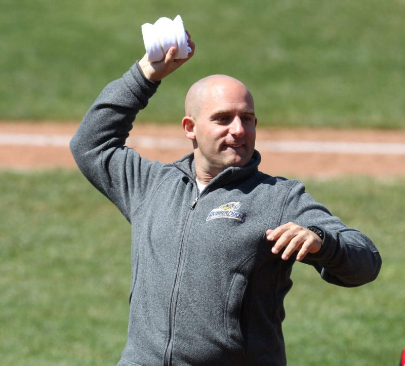 Akron RubberDucks owner Ken Babby throws T-shirts to fans in the stands during the game against the Trenton Thunder at Canal Park.