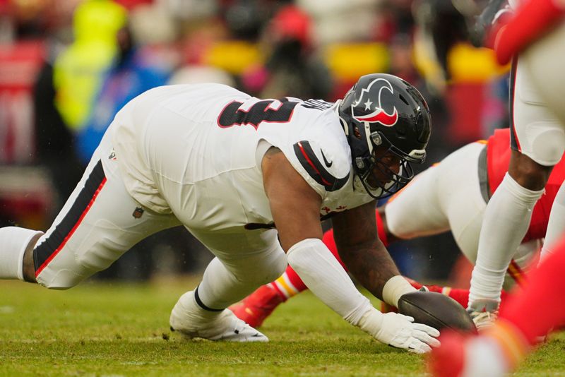 Jan 18, 2025; Kansas City, Missouri, USA; Houston Texans guard Shaq Mason (69) dives to cover a fumble against the Kansas City Chiefs during the second quarter of a 2025 AFC divisional round game at GEHA Field at Arrowhead Stadium. Mandatory Credit: Jay Biggerstaff-Imagn Images