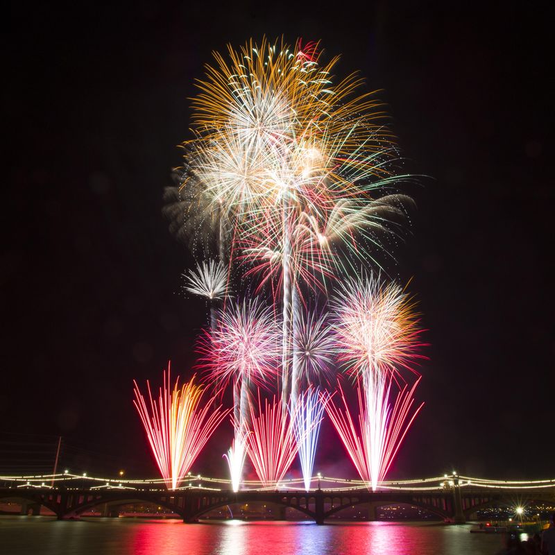 Fireworks rocket into the sky at Fourth of July Tempe Town Lake Festival on July 4, 2013.