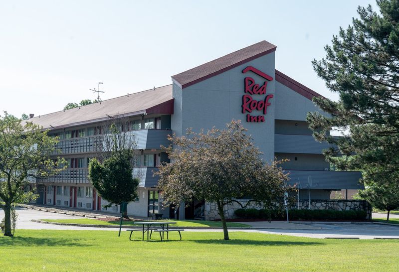 The Red Roof Inn at 2939 S. Arlington Road in Springfield Township, pictured on June 20, is up for auction