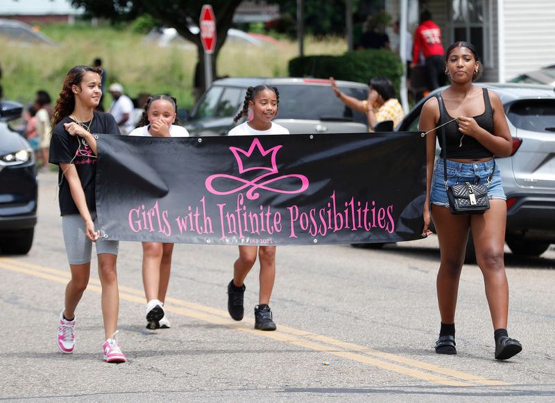 Members of Girls With Infinite Possibilities walk Saturday, June 21, 2025, during the Alliance Juneteenth Community Festival parade.